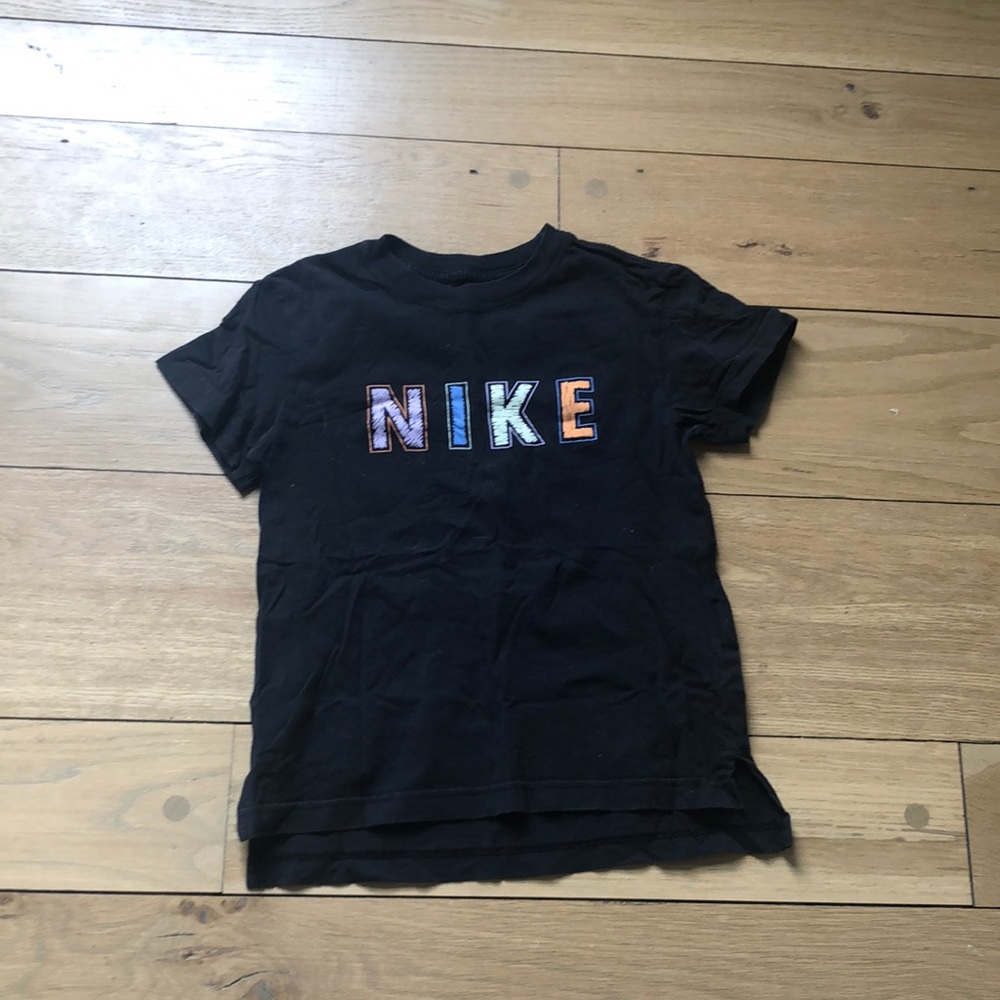 Black Nike tee with colorful letters